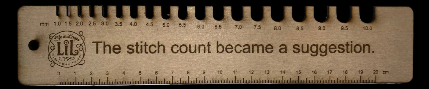 Wooden ruler with text on a white background